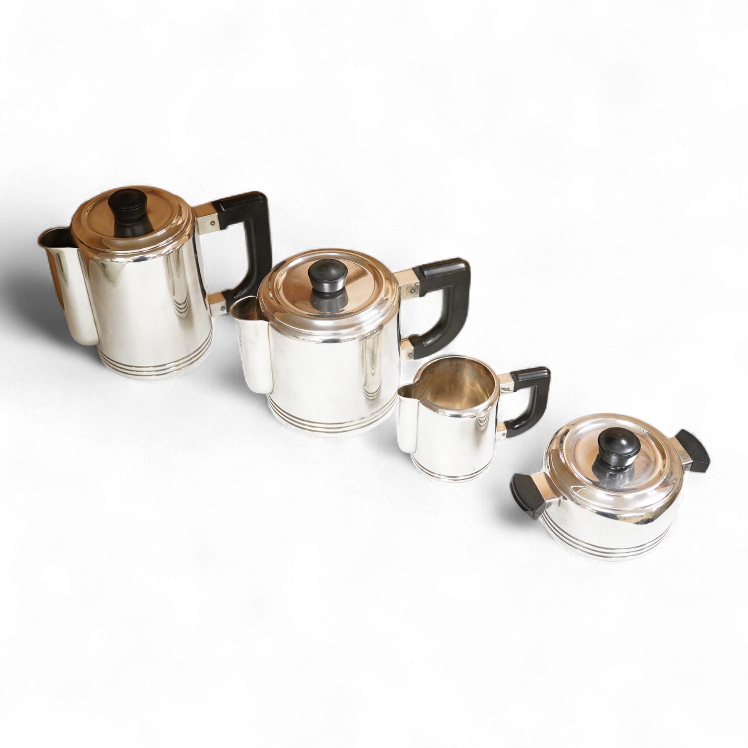 An Art Deco Christofle Gallia four piece silver plated tea set, largest 20cm wide